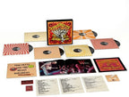 Collection of vinyl records and packaging with colorful design on a white background