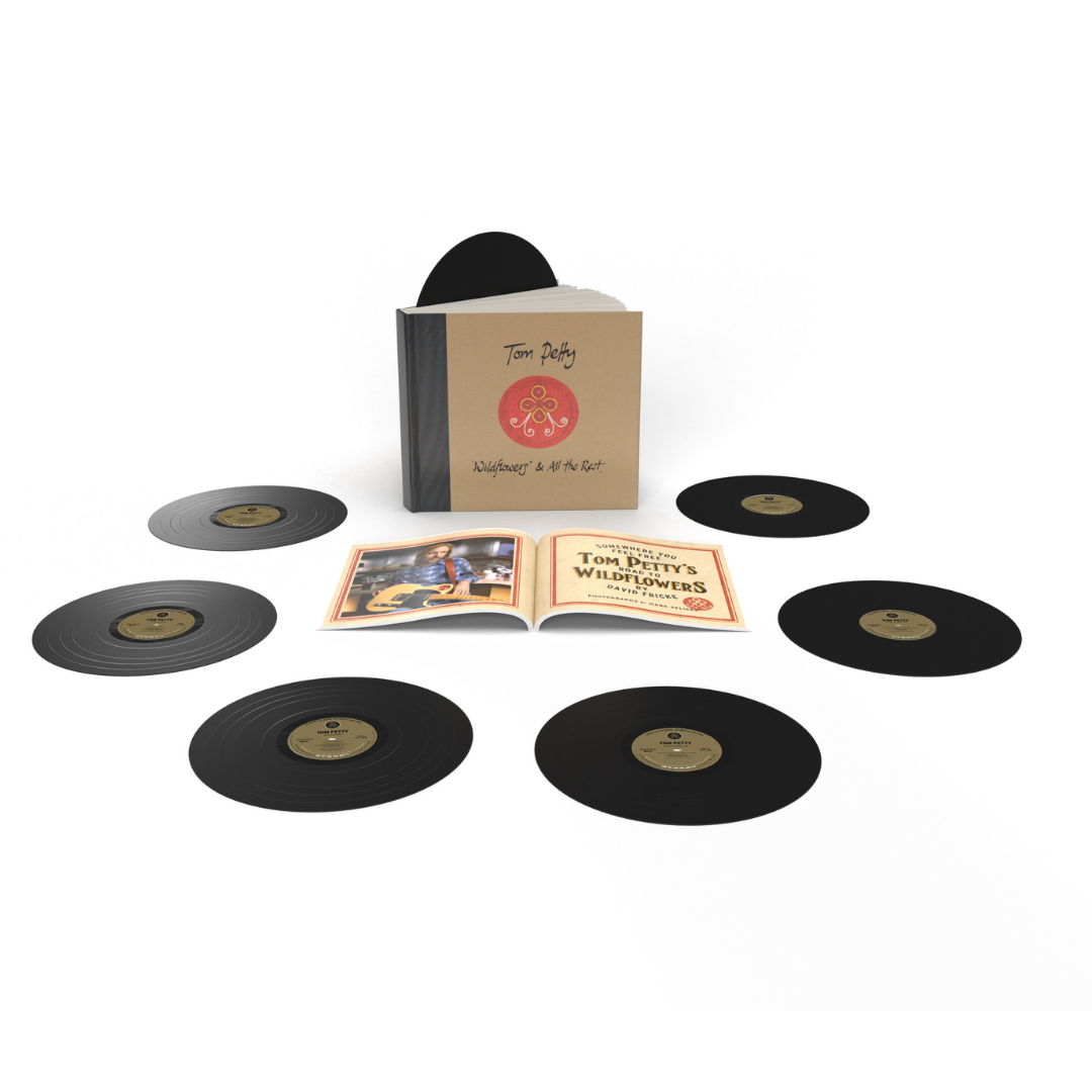 Vinyl record set with a box and booklet on a white background
